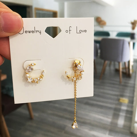 Asymmetrical moon earrings